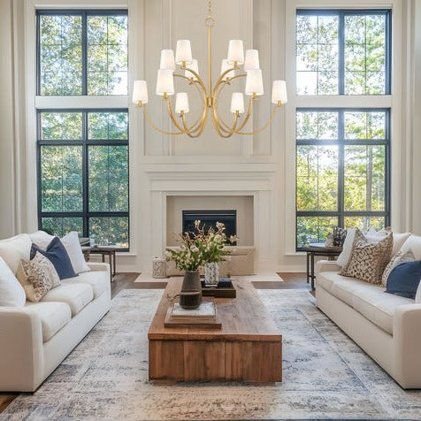 Living room lighting - gold chandelier in bright living room | Lighting House Orillia